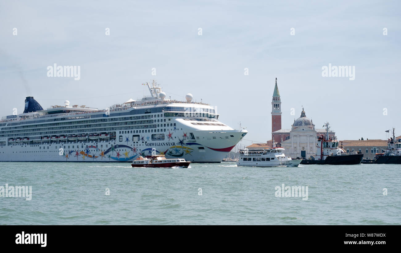 Cruise ship sailing through Venice with tug boats Stock Photo Alamy