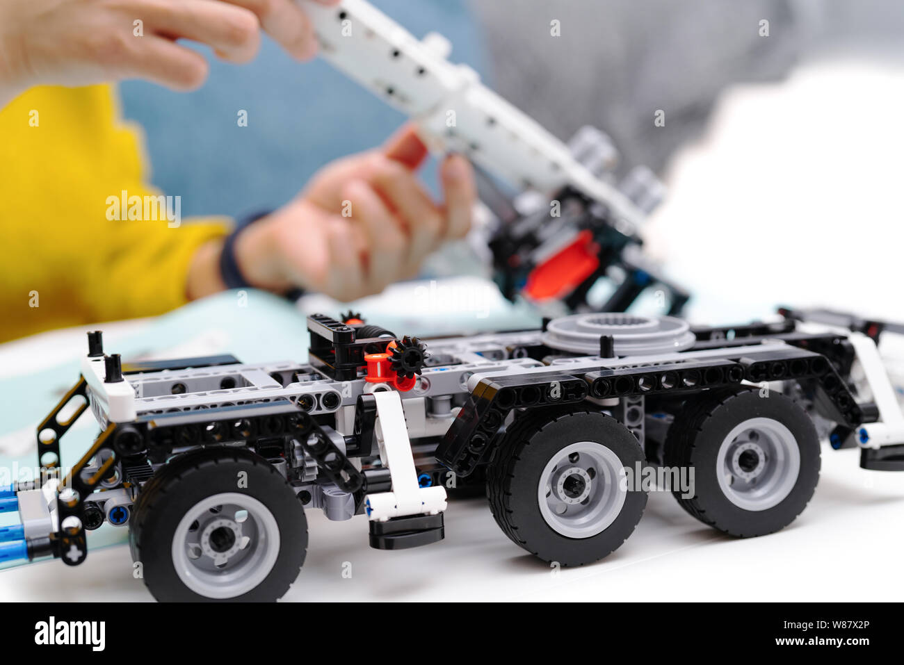 car assembly kit, woman assemble a very complicated and common car