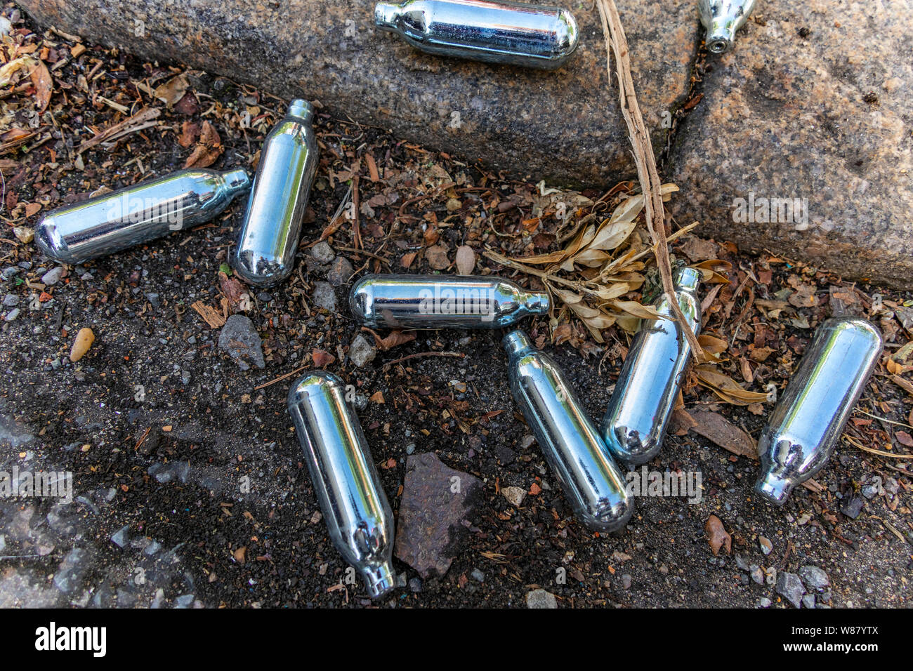 Discarded Nitrous oxide canisters discarded in street, London, UK Stock Photo Alamy
