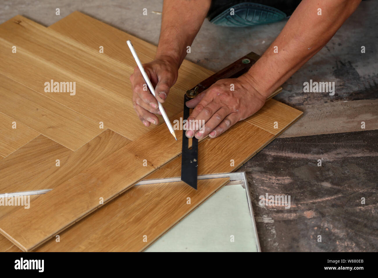 Worker Laying Parquet Flooring Worker Installing Wooden