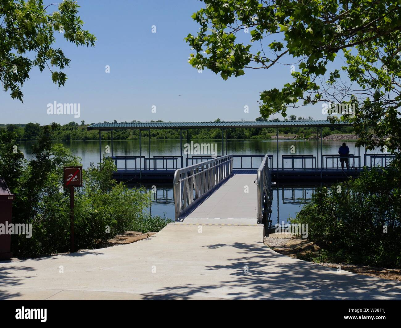 Wide shot of the floating dock with the silhouette of an unrecognizable
