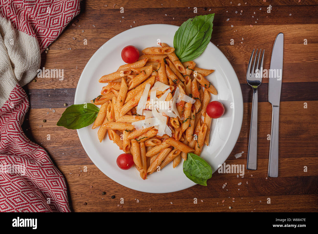 Pasta served with cheese on wooden table background Stock Photo