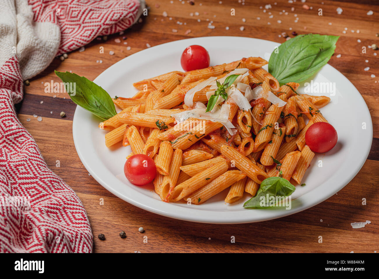 Pasta served with cheese on wooden table background Stock Photo