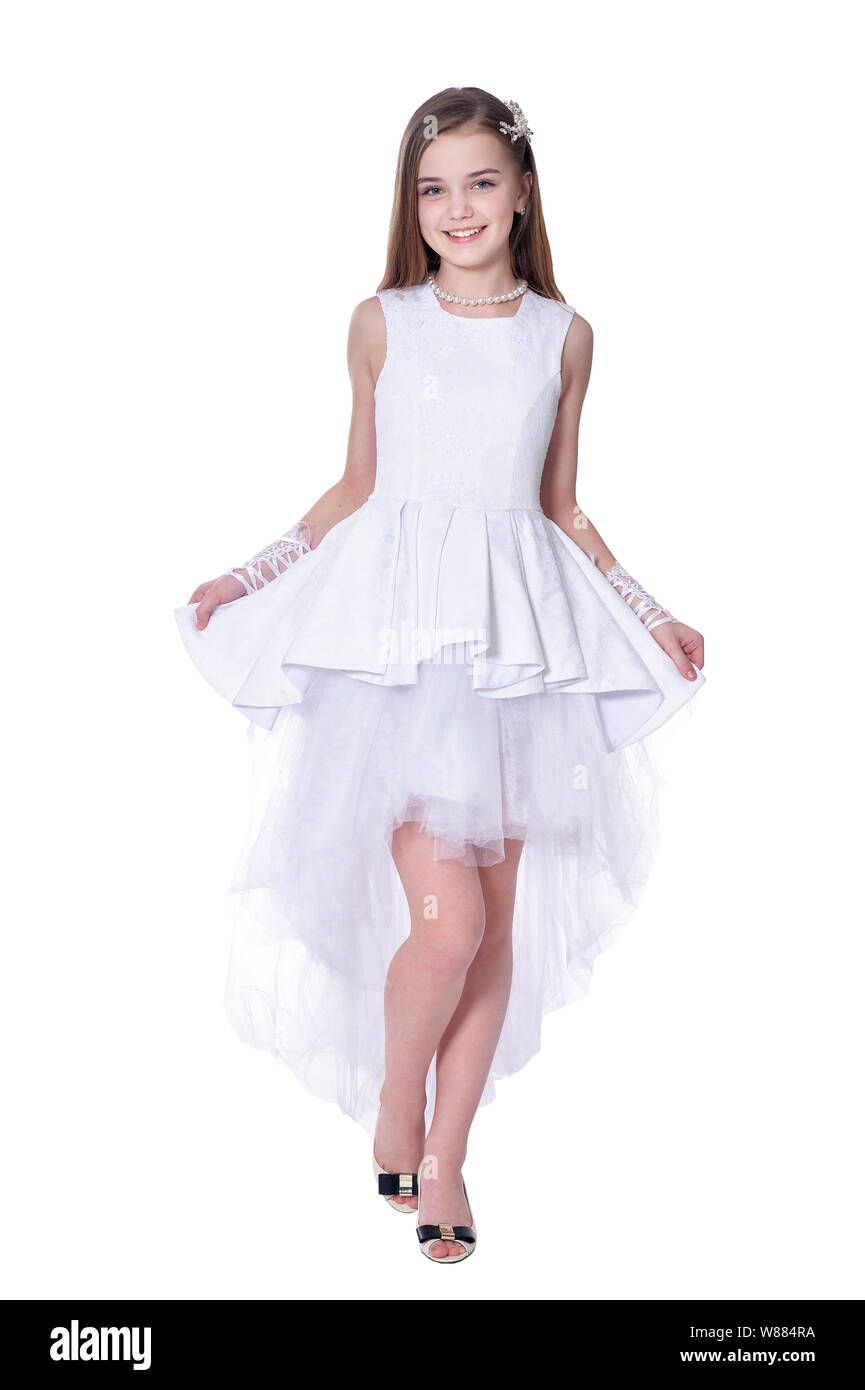 Happy beautiful little girl in white dress posing on white background Stock Photo Alamy