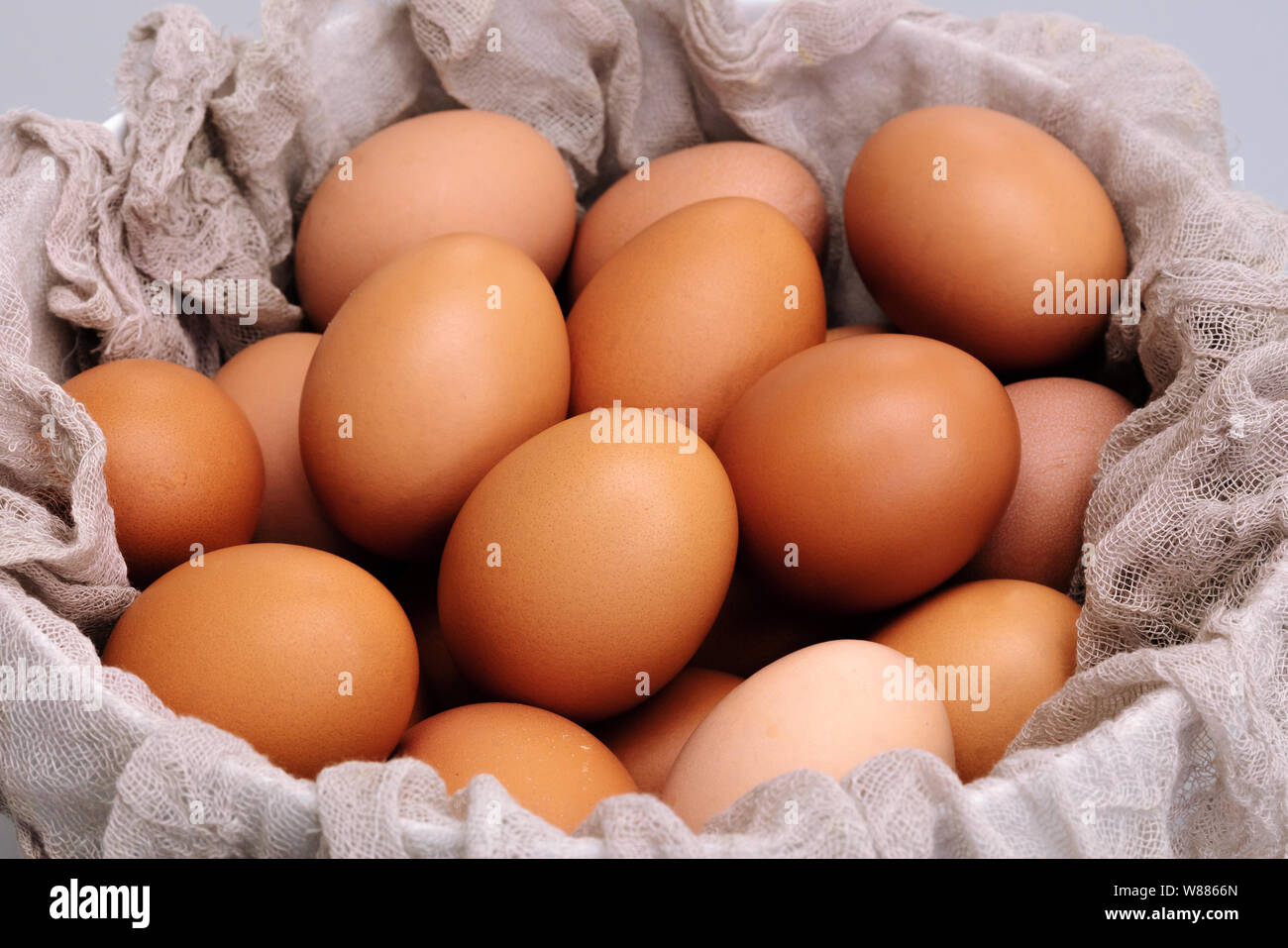 brown chicken eggs bowl on gray background, easter egg festive Stock Photo