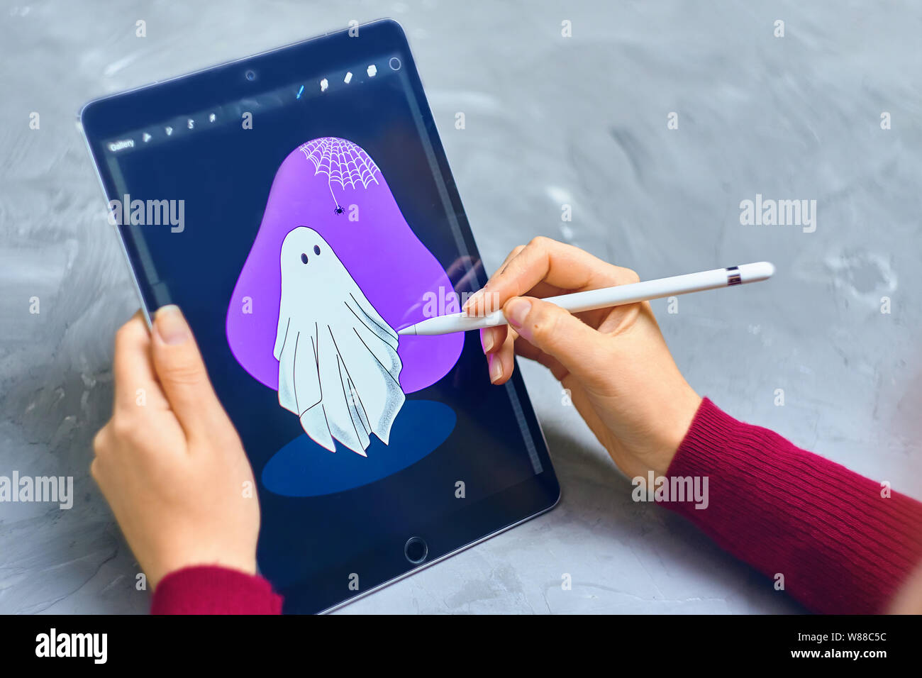 Bishkek Kyrgyzstan January 21 19 Woman Illustrator Draws Ghost On Ipad Pro In Procreate Program Using Apple Pencil Stock Photo Alamy