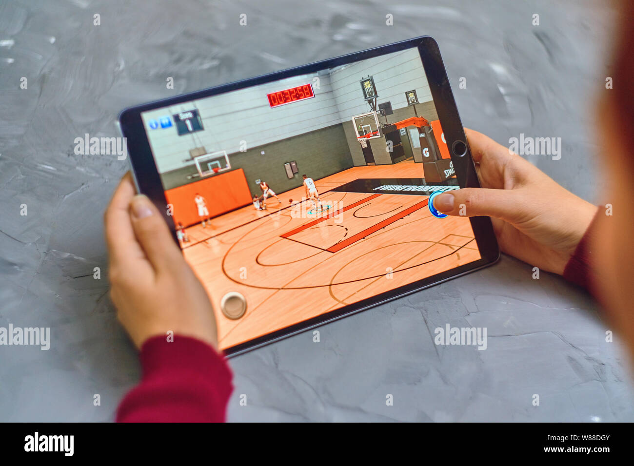 Bishkek, Kyrgyzstan January 21, 2019 Woman plays NBA 2k mobile