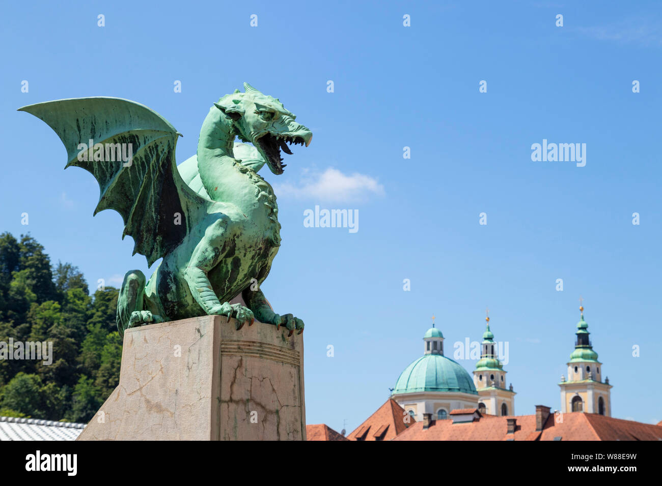 Dragon Bridge dragon statue on the Dragon bridge Zmajski most in front of the Ljubljana Cathedral Ljubljana Slovenia Eu Europe Stock Photo