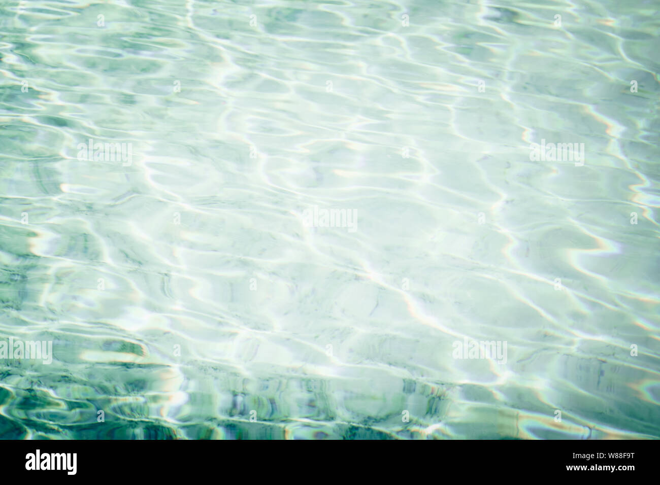Abstract pool water surface waves sea and sun reflect for background Stock Photo