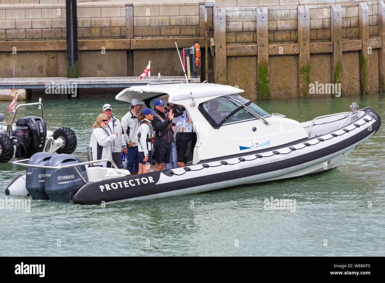 Cowes, Isle of Wight, Hampshire UK. 8th Aug 2019.  Kings Cup Sailing hosted by Duke and Duchess of Cambridge takes place a day early because of the weather forecast. Kate, Kate Middleton, and Will, Prince William, make their way to their boats on Targa Protector rigid hull inflatable boat RIB. Credit: Carolyn Jenkins/Alamy Live News Stock Photo