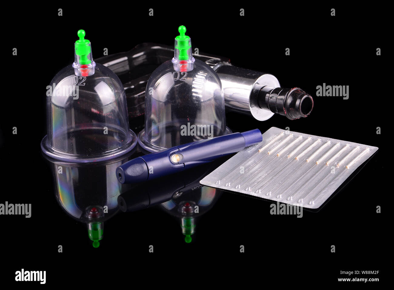 Acupuncture therapist equipment or Bekam Hijamah over black background