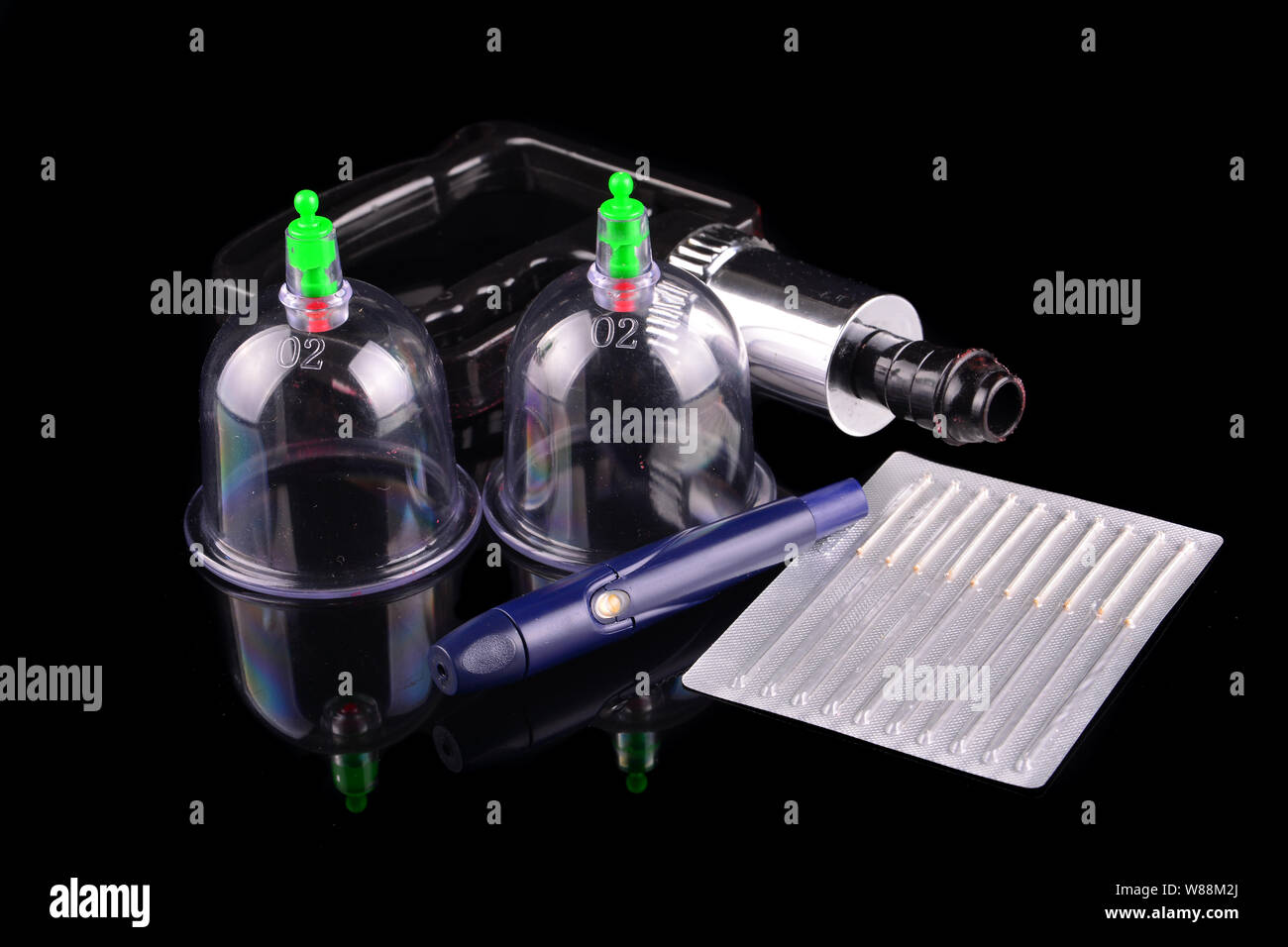 Acupuncture therapist equipment or Bekam Hijamah over black background