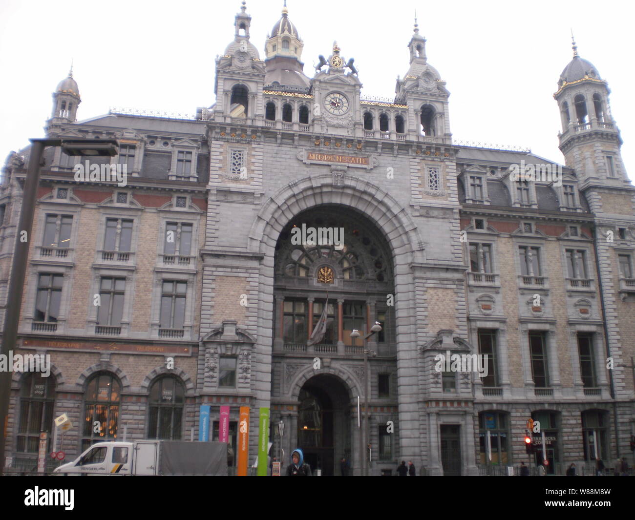 Main facade of the Central Station of Antwerp on a snowy day in the