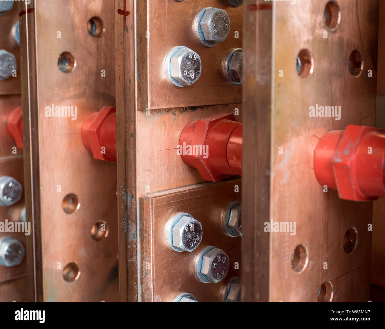 High current electrical distribution system with copper plates, steel