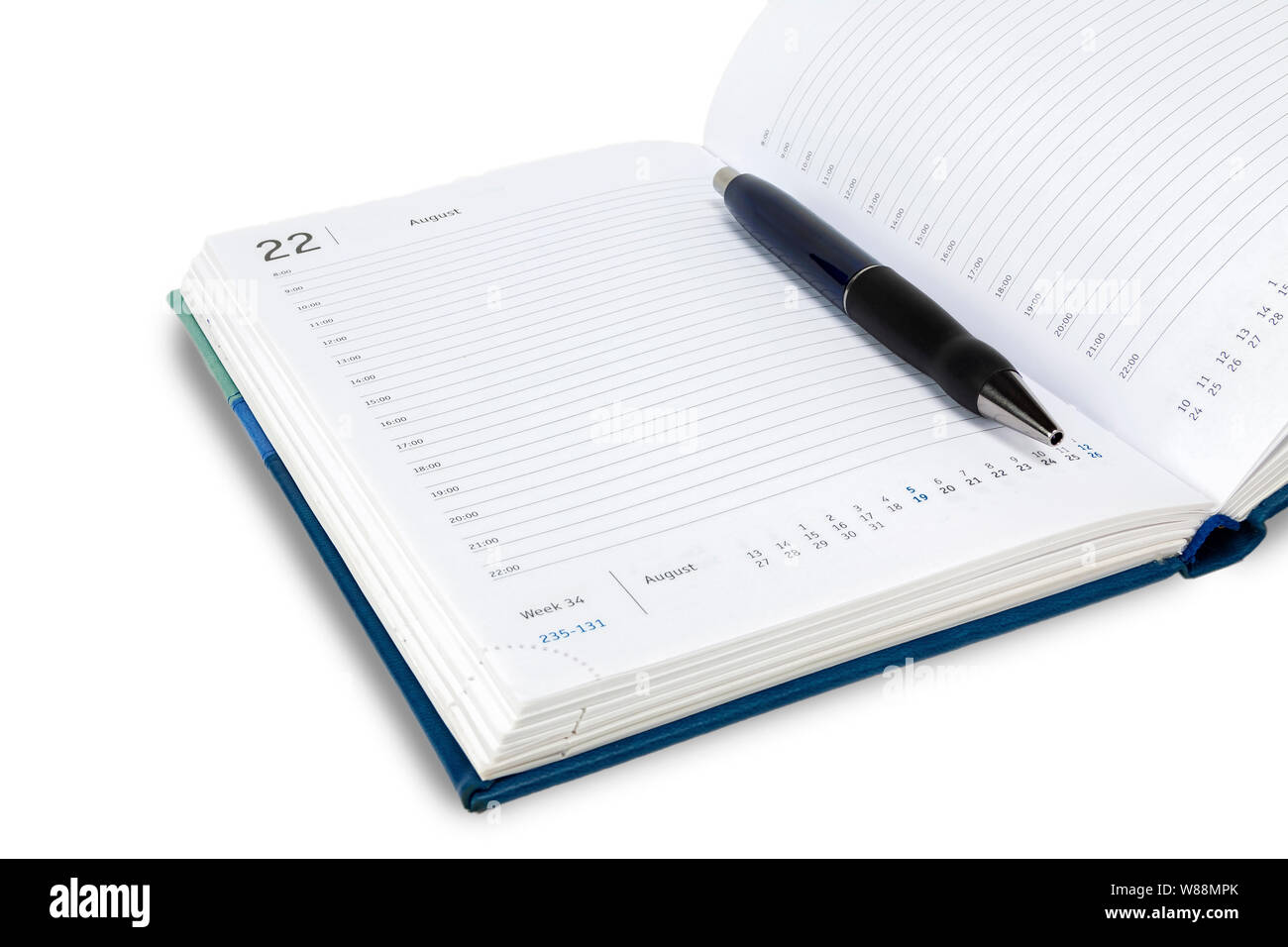 Automatic pen lies on the weekly. All on a white background, isolate. Stock Photo