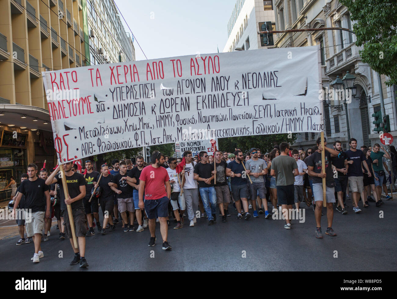 Athen, Greece. 08th Aug, 2019. Students and trade unions take to the streets with a protest poster during a demonstration against the circumcision of university asylum at Greek universities. The new conservative government in Athens has restricted the worldwide unique Greek university asylum. On Thursday evening, a majority in parliament agreed that the police could intervene in future in the event of riots and criminal cases on campus. Credit: Socrates Baltagiannis//dpa/Alamy Live News Stock Photo