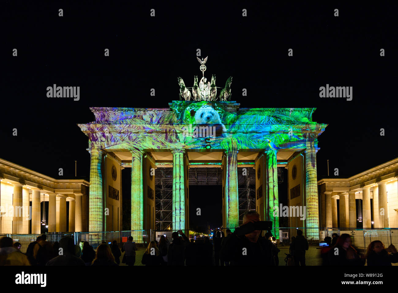 People enjoy event Festival of Lights, Berlin leuchtet, the projection  mapping lighting art at Brandenburg Gate during the night Stock Photo -  Alamy