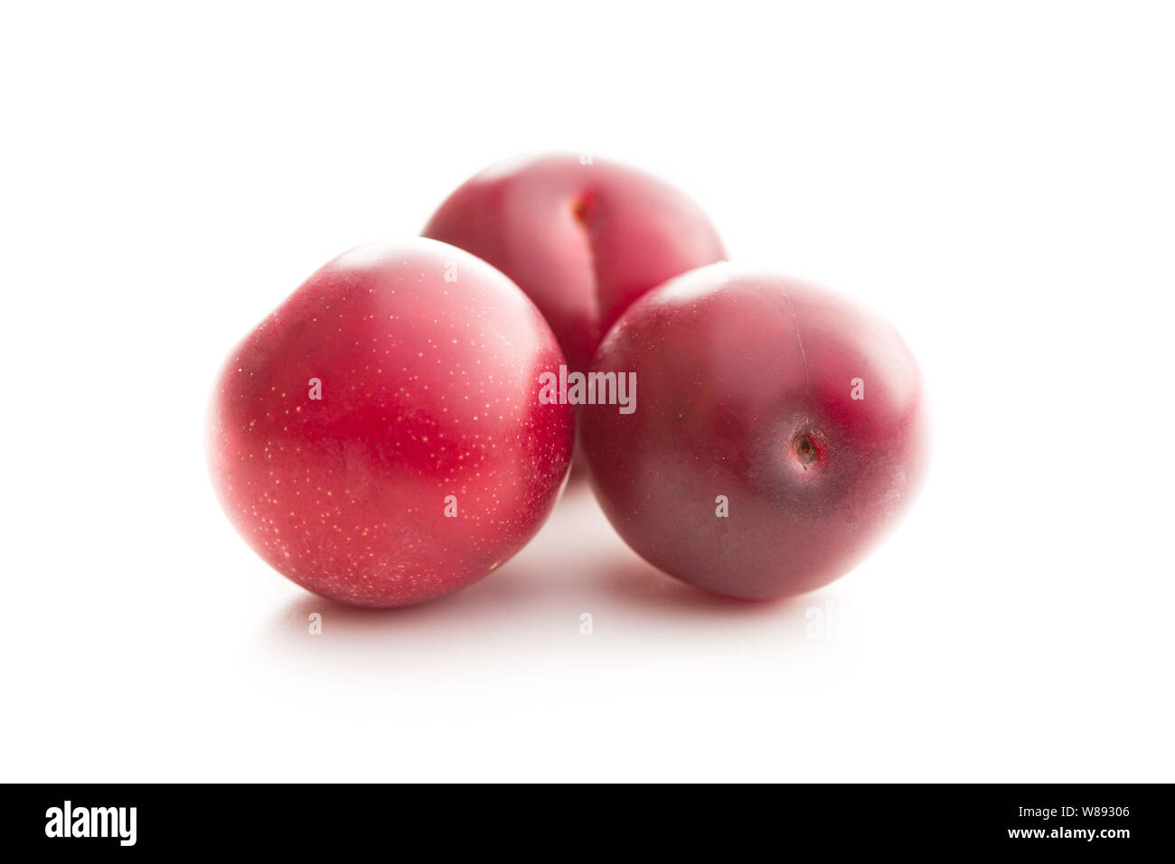 The red cherry plums fruit isolated on white background. Stock Photo