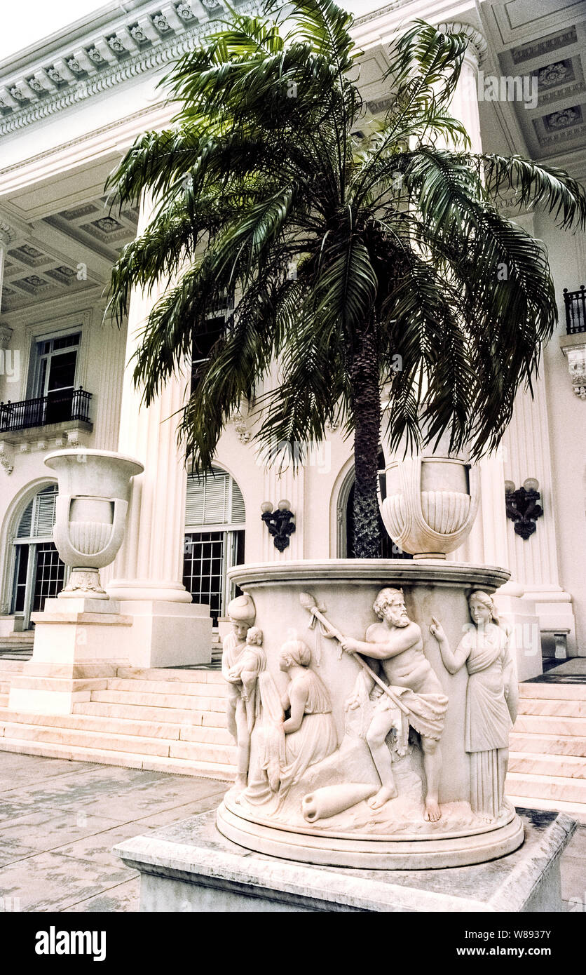 This sculpted marble urn adorns the grand entrance to Whitehall, the opulent winter home of oil and railroad magnate Henry M. Flagler and his third wife that was built in 1902 in Palm Beach on the east coast of Florida, USA. The 75-room Beaux Arts-style mansion was the focal point of Palm Beach's high-society social scene during America's Gilded Age. After Flagler died in 1913 at age 88 from a fall down a marble staircase in his home, the enormous structure became a hotel and then fell into disuse before being restored and reopened as the Flagler Museum in 1960. Stock Photo