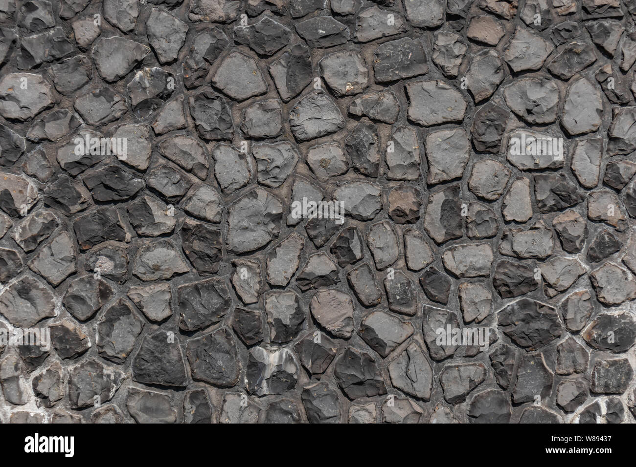Black color cobblestone street texture, background, high angle, top view Stock Photo