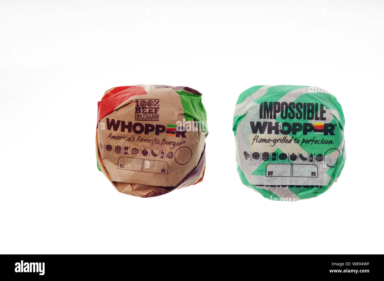 Impossible Meat Whopper and a 100% Beef Whopper side by side in wrappers Stock Photo