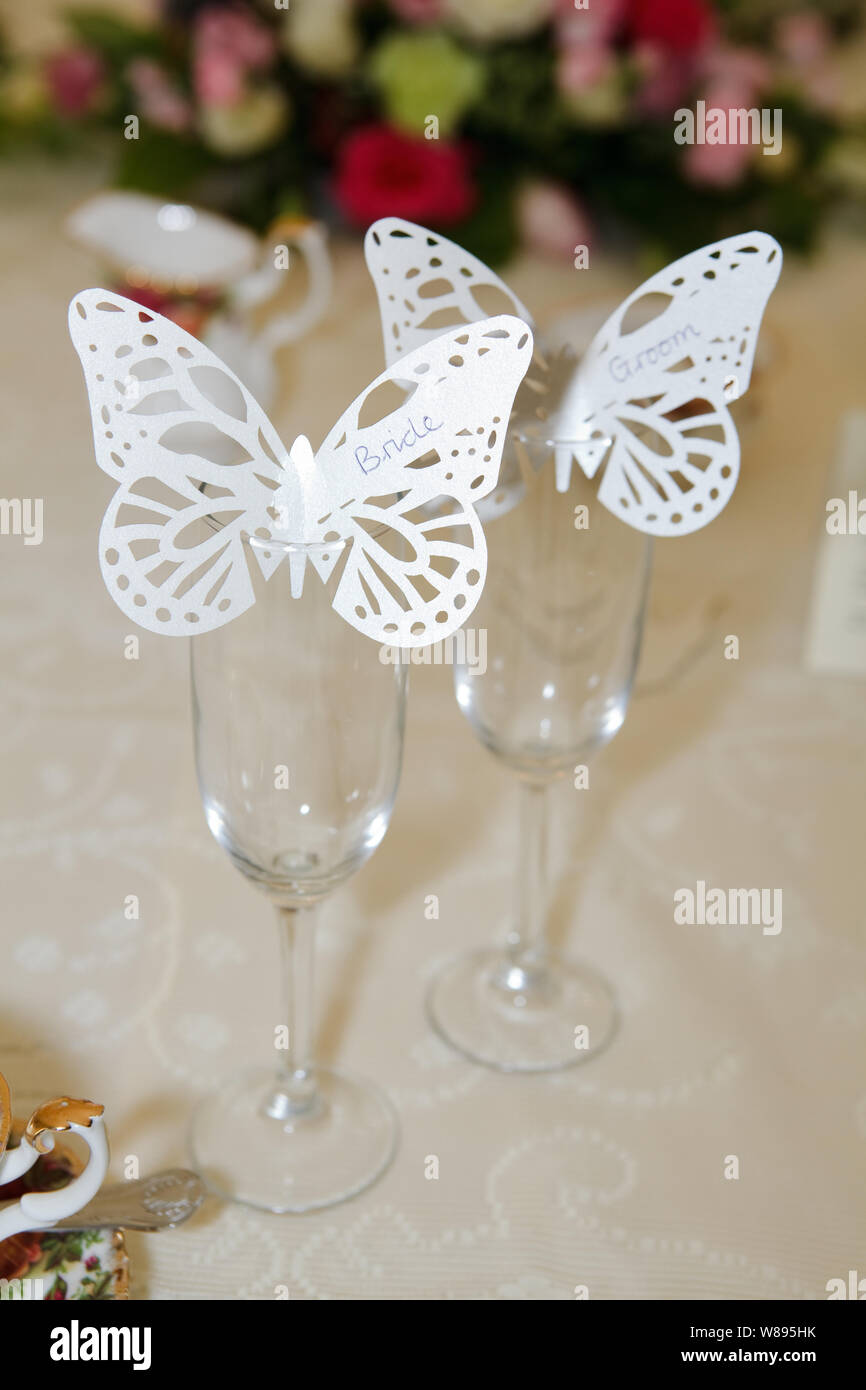 Butterfly Name Tags on Champagne Glasses Stock Photo Alamy