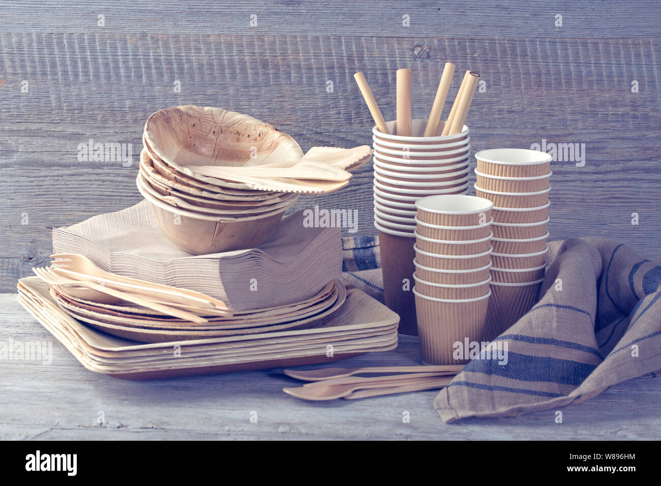 Eco friendly disposable tableware on a wooden background Stock Photo