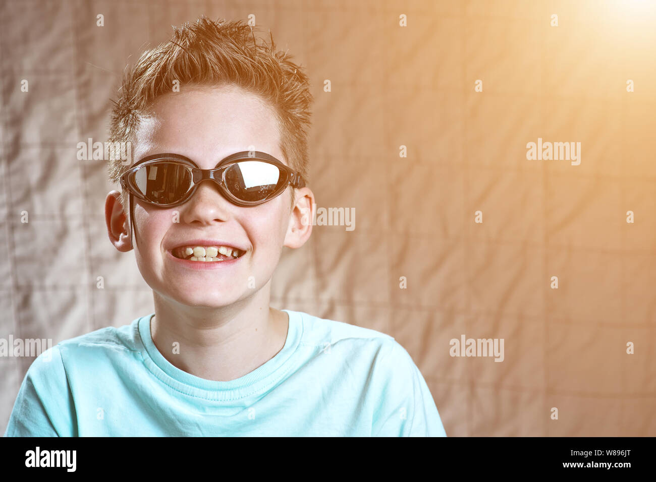 portrait of a boy in swimming goggles in different poses Stock Photo