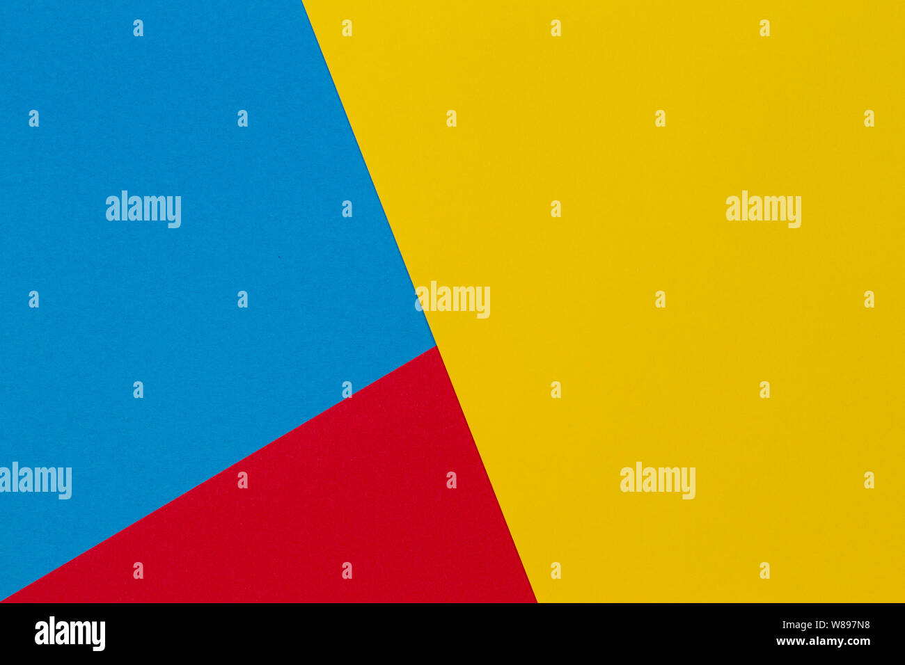 Abstract yellow, red and light blue color paper geometry composition ...