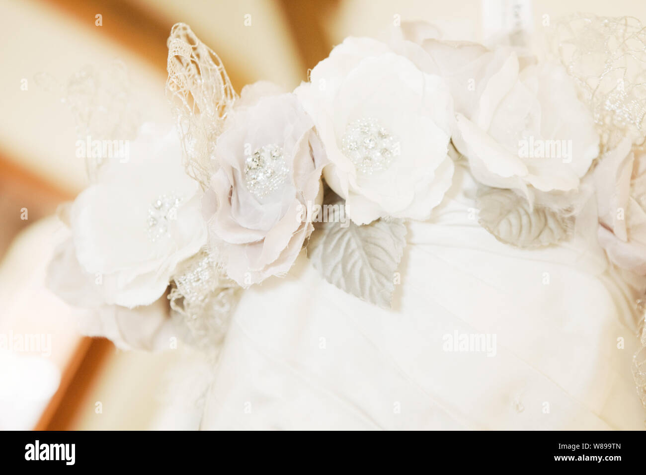 Close Up of Material Flowers on Wedding Dress Stock Photo