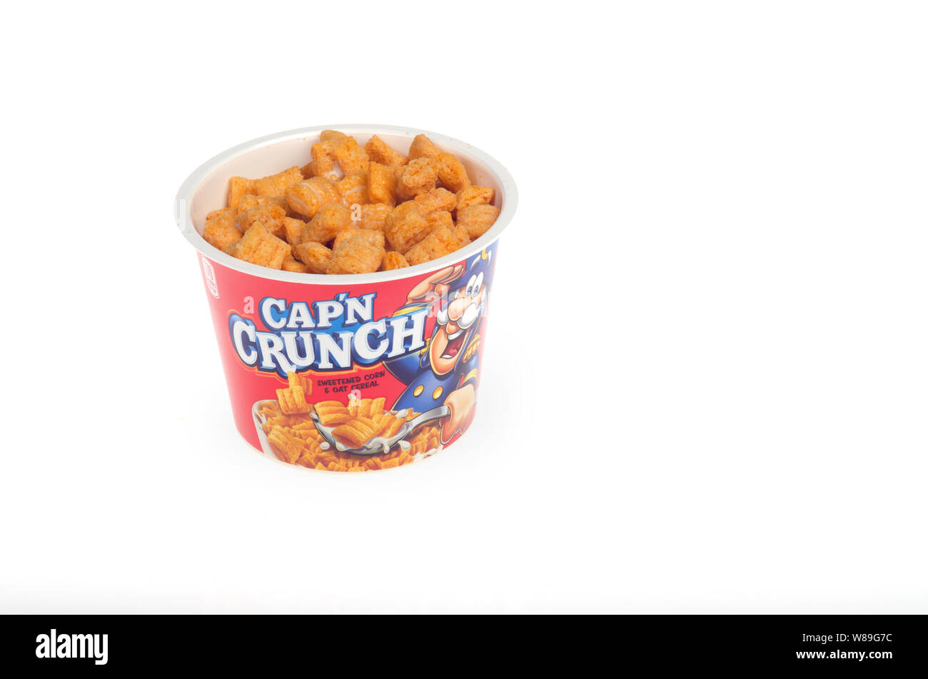Cap’n Crunch cereal cup with milk Stock Photo