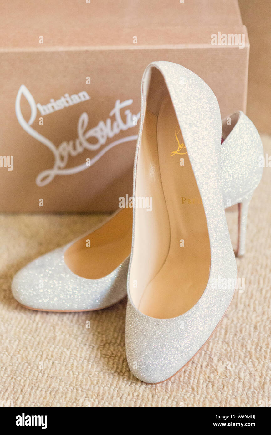 Christian Louboutin high heel golden shoes with studs and red sole in  fashion luxury store in Monte Carlo, Monaco – Stock Editorial Photo ©  AndreaA. #266341698
