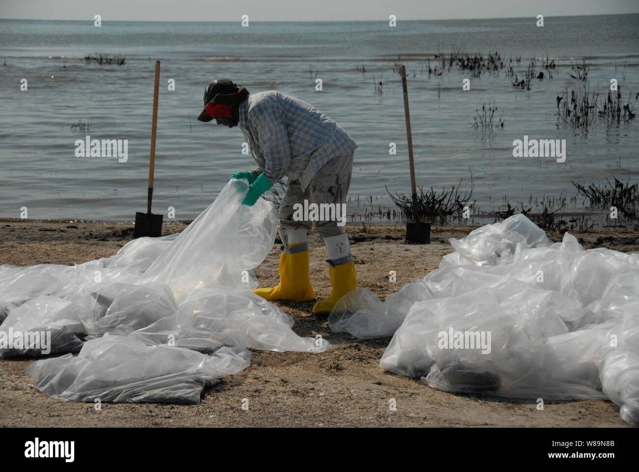 Deepwater Horizon oil spill beach cleanup. Stock Photo