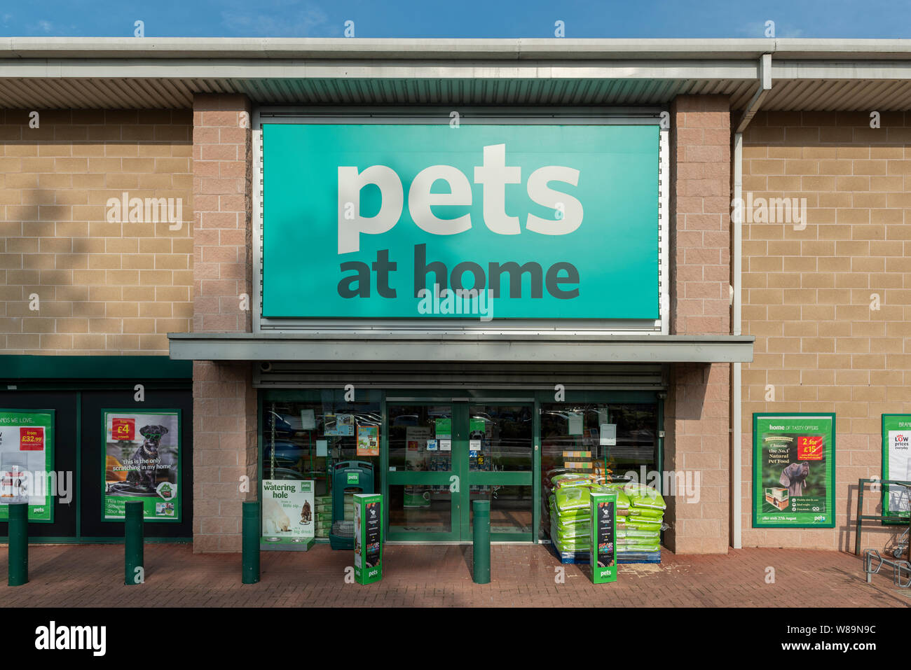 The storefront of the retailer Pets at Home on a retail park in Baguley, Manchester. (Editorial use only). Stock Photo