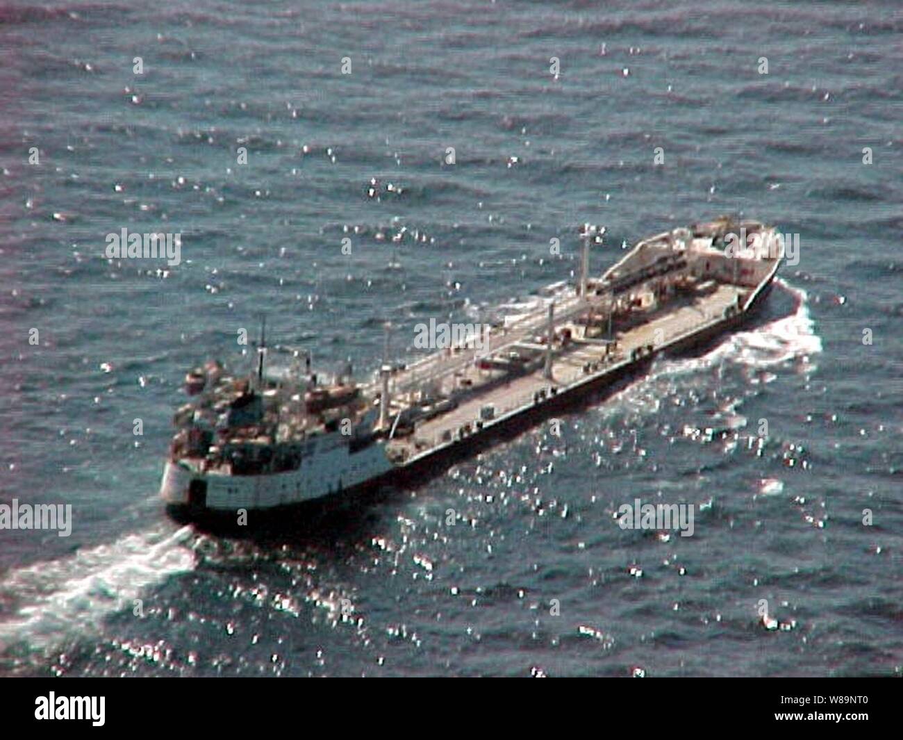 Shadowed by assets of the multinational  Maritime Interception Force the Russian-flagged tanker Volgoneft-147 steams on Feb. 3, 2000.  The Volgoneft-147 was boarded in international waters on Feb. 2 during interception operations conducted by the Ticonderoga class cruiser USS Monterey (CG 61).  While operating under the authority of United Nations Security Council Resolution 665, the multinational Maritime Interception Force routinely intercepts and boards vessels suspected of carrying contraband. Stock Photo