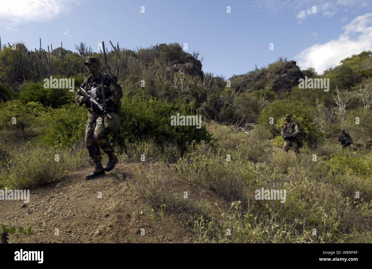 Soldiers from the Army's 166th Infantry, 2nd Battalion, Charlie Company conduct a dismonted patrol in Guantanamo Bay, Cuba.   At Joint Task Force Gantanamo, the infantry provides security to the detainee compound. Stock Photo