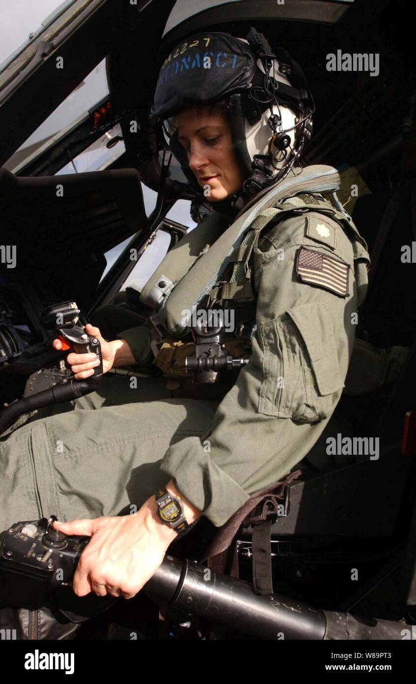 U.S. Navy Lt. Cmdr. Julie Antonacci completes pre-flight checks prior to take off in a SH-60 Seahawk helicopter aboard the aircraft carrier USS Nimitz (CVN 68) on May 15, 2005.  The Nimitz and its embarked Carrier Strike Group is deployed in support of the global war on terrorism.  Antonacci is assigned to Helicopter Anti-Submarine Squadron 6. Stock Photo