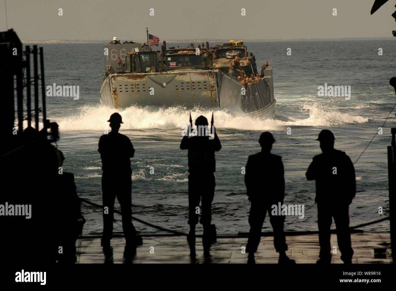 U.S. Navy Landing Craft Unit 1664 makes it's approach towards the well deck of the USS Nassau (LHA 4) as the ship operates in the Atlantic Ocean on June 27, 2005.  The craft is carrying U.S. Marines and their equipment from the 22nd Marine Expeditionary Unit.  The USS Nassau is a Tarawa class amphibious assault ship home ported in Norfolk, Va. Stock Photo