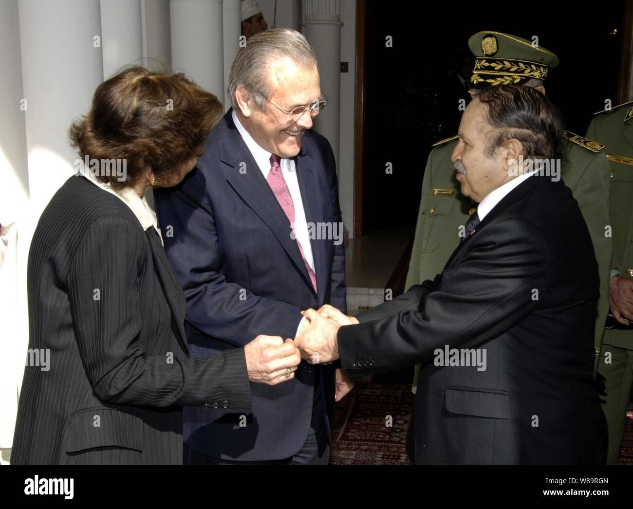Secretary of Defense Donald H. Rumsfeld says goodbye to Algerian President Abdelaziz Bouteflika in Algiers, Algeria, on Feb. 12, 2006.  Rumsfeld met with delegations from the Mediterranean Dialogue countries of Algeria, Egypt, Israel, Jordan, Mauritania, Morocco and Tunisia earlier at the NATO Ministerial in Taormina, Sicily.  Rumsfeld and Bouteflika met in Algiers to continue those talks and discuss regional security issues. Stock Photo