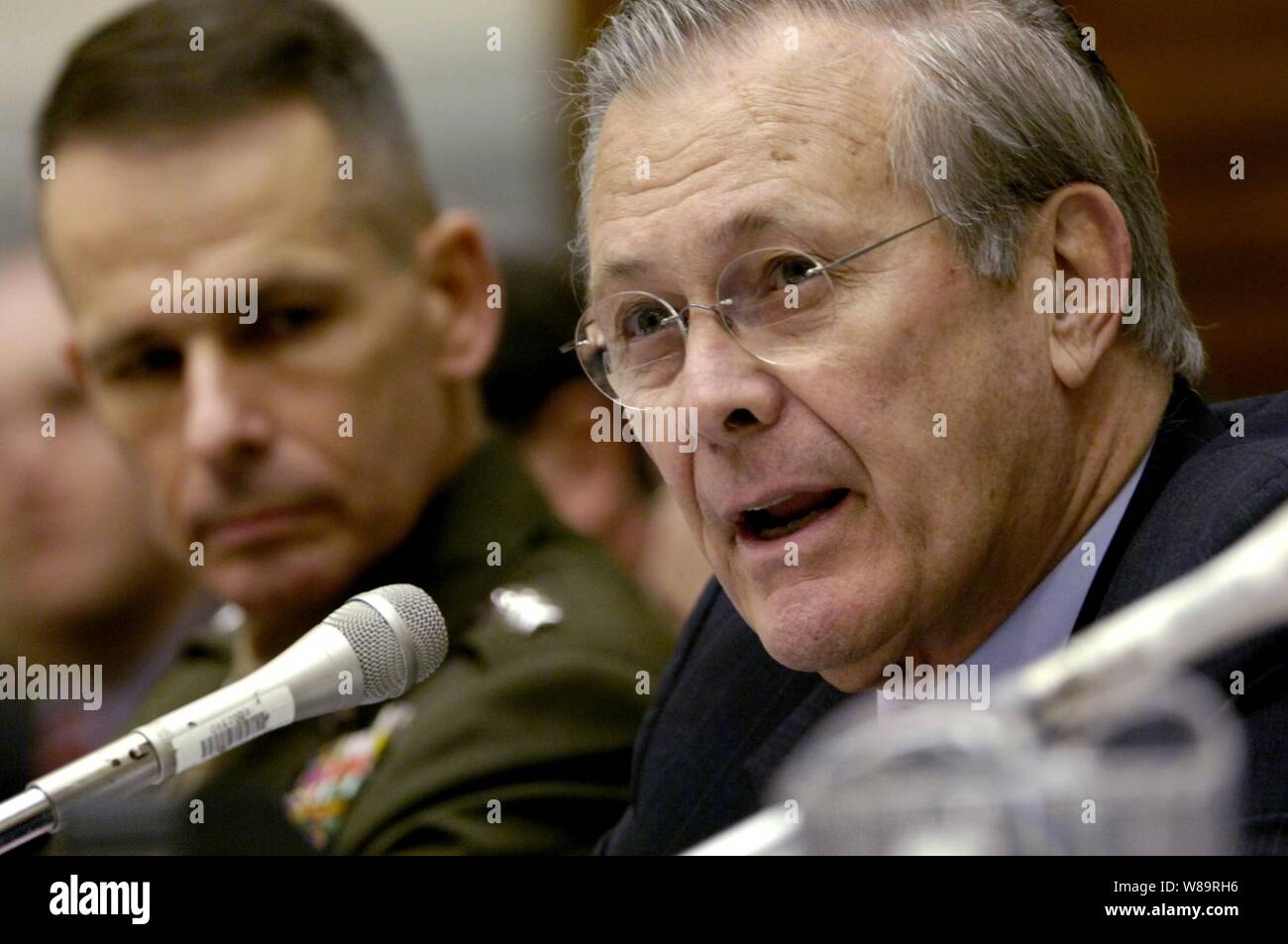 Secretary of Defense Donald H. Rumsfeld delivers his opening remarks during his testimony before the House Armed Services Committee hearing at the Rayburn House Office Building in Washington, D.C., on Feb. 8, 2006.  Chairman of the Joint Chiefs of Staff Gen. Peter Pace (left), U.S. Marine Corps, and Chief of Staff of the U.S. Army Gen. Peter Schoomaker joined Rumsfeld in testifying before the committee. Stock Photo