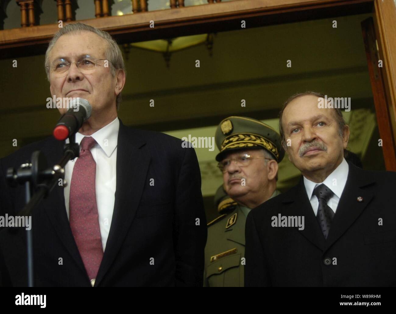Secretary of Defense Donald H. Rumsfeld and Algerian President Abdelaziz Bouteflika listen to a reporter's question during a press availability on the steps of the Presidential Palace in Algiers, Algeria, on Feb. 12, 2006.  Rumsfeld met with delegations from the Mediterranean Dialogue countries of Algeria, Egypt, Israel, Jordan, Mauritania, Morocco and Tunisia earlier at the NATO Ministerial in Taormina, Sicily.  Rumsfeld is meeting with Bouteflika in Algiers to continue those talks and discuss regional security issues. Stock Photo