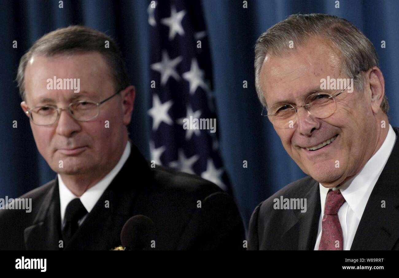 Secretary of Defense Donald H. Rumsfeld and Vice Chairman of the Joint Chiefs of Staff Adm. Edmund G. Giambastiani Jr., U.S. Navy, listen to a question during a Pentagon press briefing in Arlington, Va., on March 23, 2006.  Rumsfeld and Giambastiani talked to reporters about the current situation in Iraq.  Rumsfeld also announced his upcoming trip to the crash site of Sept. 11, 2001, United Flight 93 in Shanksville, Pa. Stock Photo