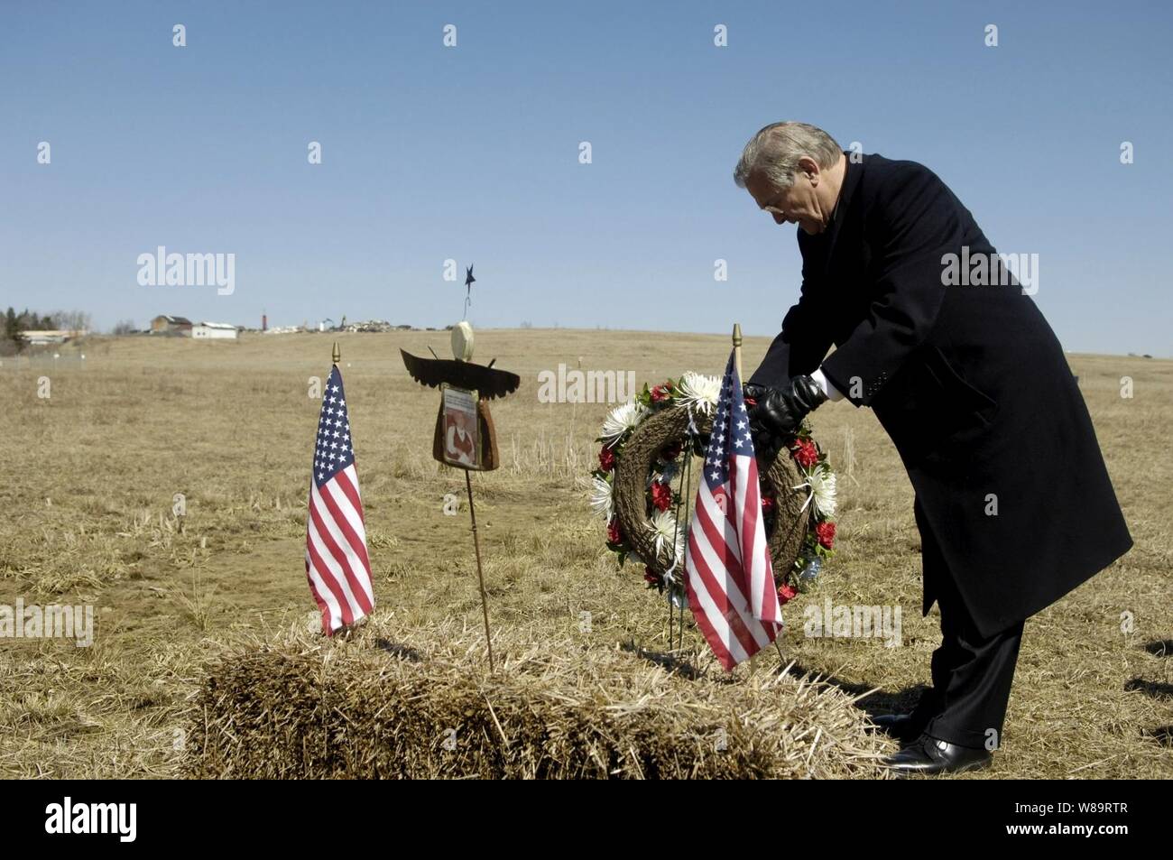 Secretary of Defense Donald H. Rumsfeld lays a wreath at the crash site of United Airlines Flight 93 in Shanksville, Pa., on March 27, 2006.  A memorial is being built to commemorate the victims that lost their lives overtaking a terrorist hijacked airplane and saving the plane from continuing its mission on Sept. 11, 2001.  Rumsfeld was in Shanksville to visit the Flight 93 National Memorial and then continue on to the Army War College in Carlisle, Pa. Stock Photo