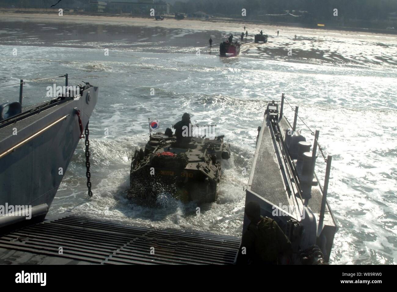 A Republic of Korea amphibious assault vehicle enters the surf from a U.S. Navy landing craft utility during an Exercise Foal Eagle combined amphibious landing in Manripo, Republic of Korea, on March 30, 2006. Foal Eagle is a joint exercise between the Republic of Korea and the U.S. Armed Forces designed to enhance war-fighting skills. Stock Photo