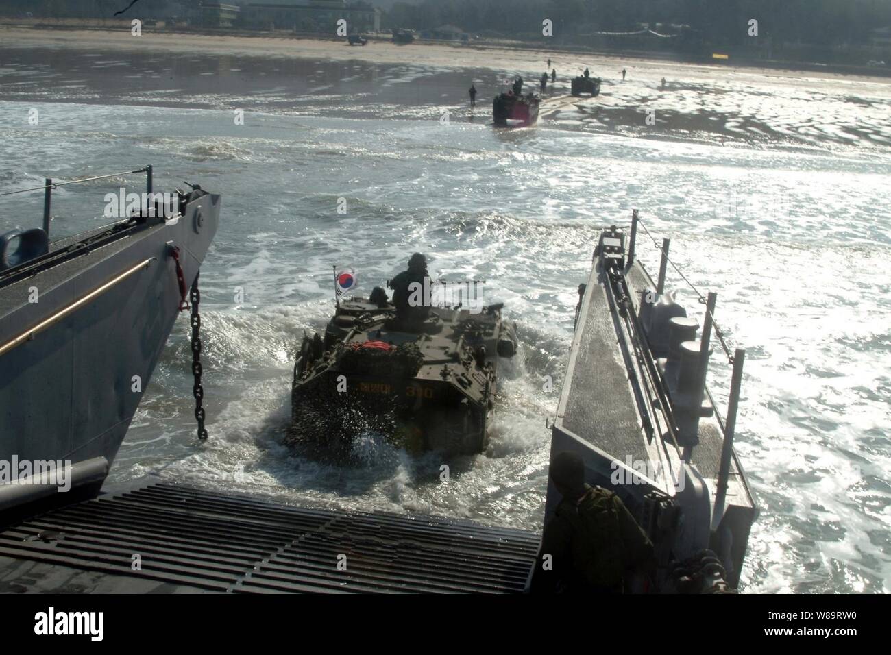 A Republic of Korea amphibious assault vehicle enters the surf from a U.S. Navy landing craft utility during an Exercise Foal Eagle combined amphibious landing in Manripo, Republic of Korea, on March 30, 2006.  Foal Eagle is a joint exercise between the Republic of Korea and the U.S. Armed Forces designed to enhance war-fighting skills. Stock Photo