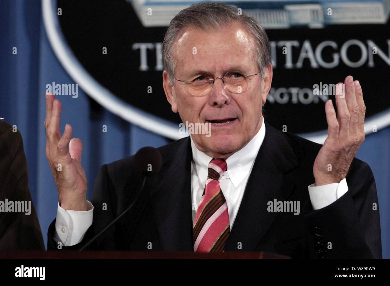 Secretary of Defense Donald H. Rumsfeld talks to reporters during a Pentagon press briefing in Arlington, Va., on March 28, 2006.  Rumsfeld spoke of his trip to the crash site of United Flight 93 on Sept. 11, 2001, in Shanksville, Pa., in his opening remarks before taking questions from reporters with Chairman of the Joint Chiefs of Staff Gen. Peter Pace, U.S. Marine Corps. Stock Photo