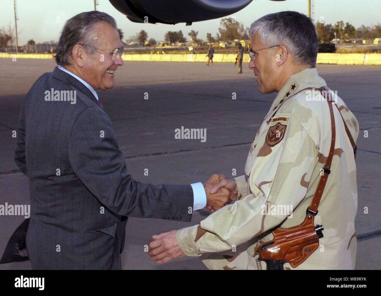 Army Gen. George Casey Jr. (right) welcomes Secretary of Defense Donald H. Rumsfeld to Baghdad, Iraq, on April 26, 2006.  Rumsfeld and Secretary of State Condoleezza Rice will meet jointly with Iraq's newly designated Prime Minister Jawad al-Maliki.  Rumsfeld will also meet with senior military leaders and troops.  Casey is the commanding general, Multi-National Force, Iraq. Stock Photo