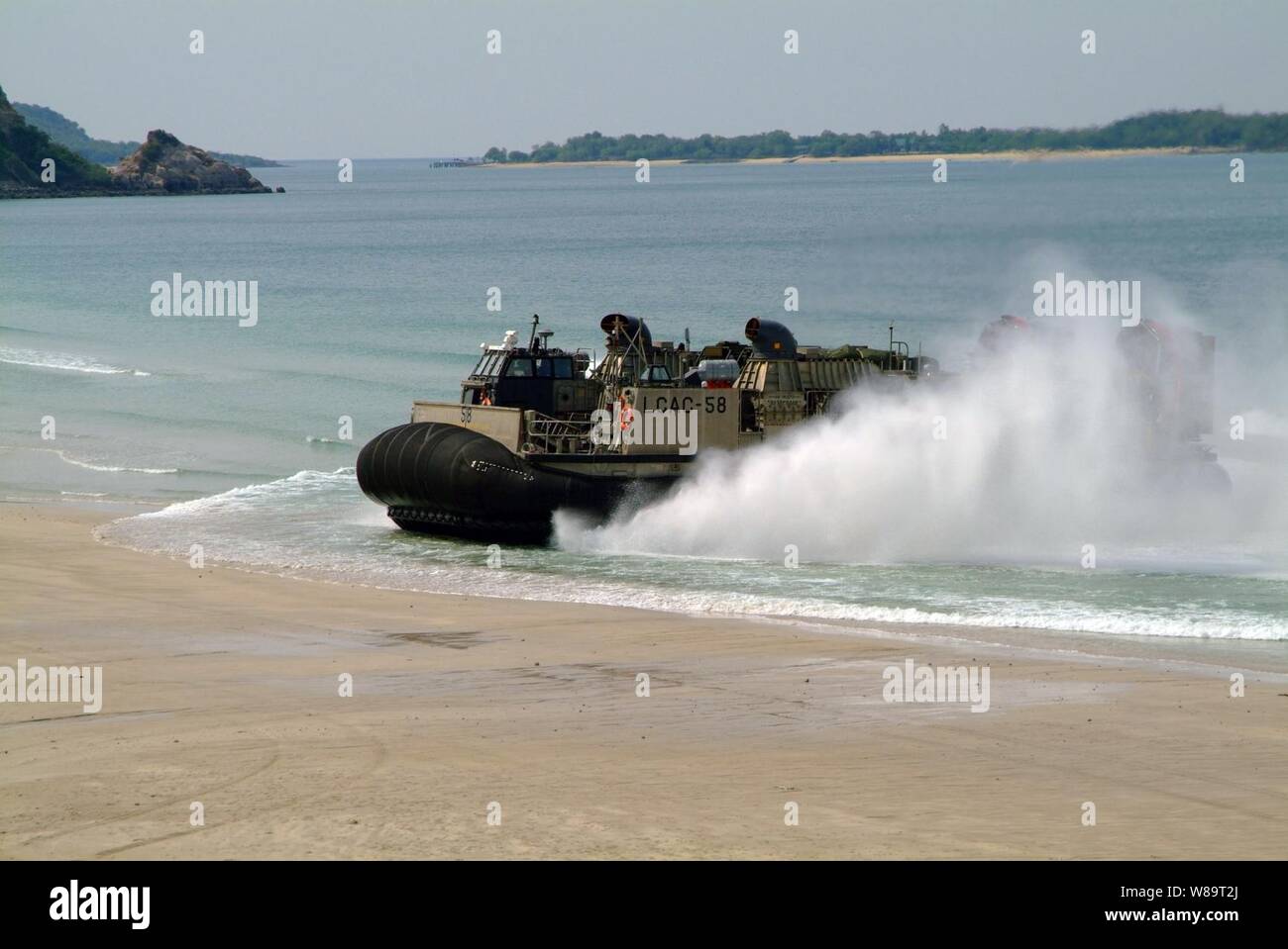 A landing craft air cushion lands on a beach in Hat Yao, Thailand, while participating in Exercise Cobra Gold 2006 on May 15, 2006.  Cobra Gold is an annual training exercise involving the United States, Thailand, Japan, Singapore, and Indonesia. Stock Photo