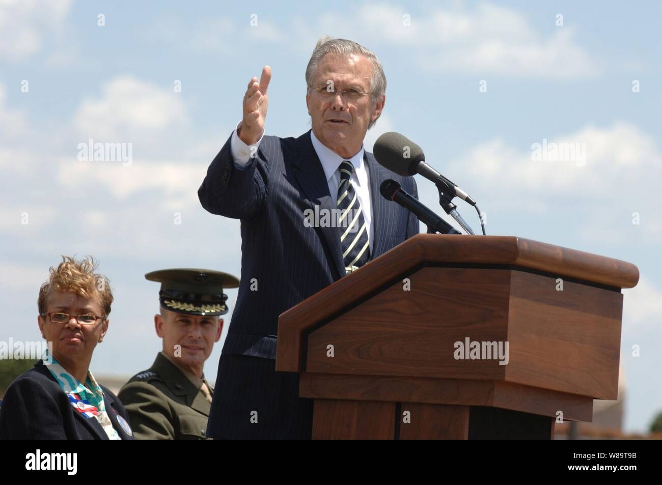 Secretary of Defense Donald H. Rumsfeld speaks to the audience during the ground-breaking ceremony to mark the beginning of work on the Pentagon Memorial at the site where 184 innocent lives were lost when terrorist hijacked American Airlines Flight 77 crashed on Sept. 11, 2001. The memorial will have cantilevered benches with reflecting pools underneath each one in memory of each victim of the attack. Fifty-nine memorial units face one direction, 125 face the other distinguishing victims on board the plane from those who lost their lives inside the Pentagon. In addition 80 Paperbark maple tre Stock Photo