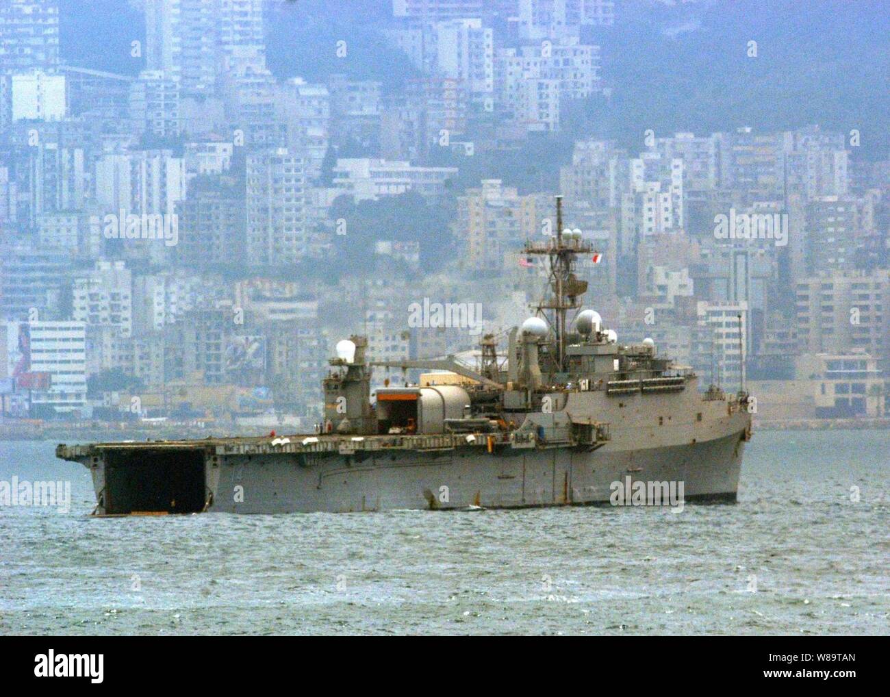 The USS Nashville (LPD 13) rides at anchor just off the coastline of Beirut, Lebanon, on July 21, 2006.  At the request of the U.S. Ambassador to Lebanon and at the direction of the Secretary of Defense, the United States Central Command and elements of Task Force 59 are assisting with the departure of U.S. citizens from Lebanon.  The Nashville is an amphibious transport which is used to carry and land Marines, their equipment and supplies by embarked air cushion or conventional landing craft, amphibious vehicles, helicopters or vertical take off and landing aircraft. Stock Photo